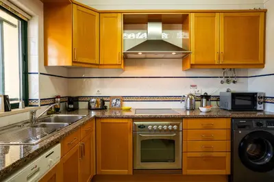 a kitchen with a sink and a stove top oven at #310 Families Only - Jardins de Santa Eulalia 03 in Branqueira