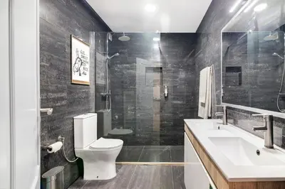 a bathroom with a toilet and a sink and a shower at Habemus Domu Albufeira in Albufeira