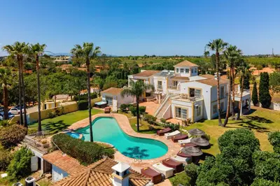 an aerial view of a house with a swimming pool at Monte Da Poupa - 7 bedroom villa - Sleeps 15 in Albufeira