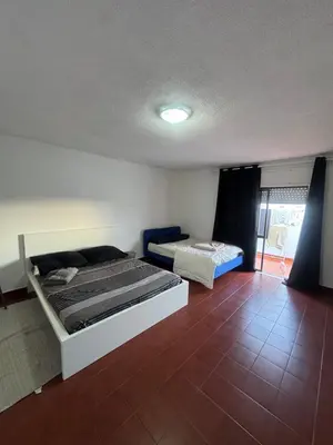 a bedroom with two beds in a room at Casa Lopes in Albufeira