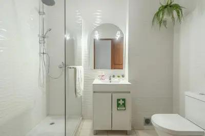a bathroom with a toilet and a sink and a shower at #351 Edificio Marina 1 D by Home Holidays in Páteo