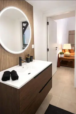a bathroom with a sink and a mirror at Casa luz e conforto-Casa 20 in Almancil
