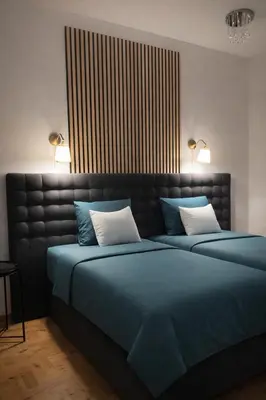a bedroom with two beds with blue sheets and white pillows at Dream House in Loulé