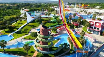 an amusement park with a roller coaster at Sol e Mar Quarteira in Quarteira