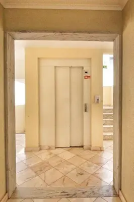 an open door in a room with a tile floor at Boa Vista Apartment with Sea Views and Shared Pool in Albufeira