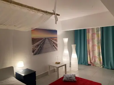 a bedroom with two white vases on the wall at Algarve Family Escape in Olhos de Água