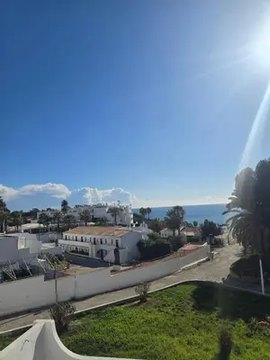a view of a city with the ocean in the background at O Forte by MTPhomes in Albufeira