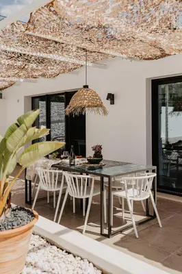 a dining room with a table and chairs at Luzico ALGARVE in Loulé