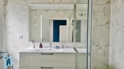 a bathroom with a sink and a mirror at Villa Barinel by Cleverdetails located in a quiet and privileged area of Vilamoura in Quarteira