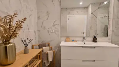 a bathroom with a sink and a mirror at Villa Barinel by Cleverdetails located in a quiet and privileged area of Vilamoura in Quarteira