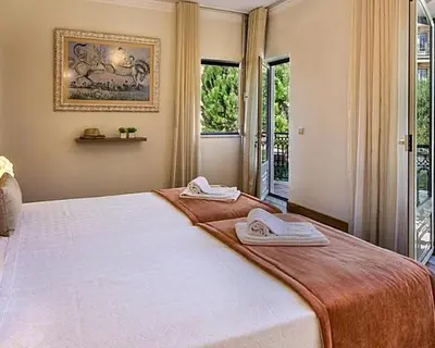 a bedroom with a large bed with two towels on it at Stunning home with nice pool in Albufeira