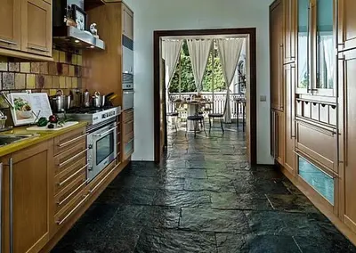 a kitchen with a counter and a table in a room at Stunning home with nice pool in Albufeira