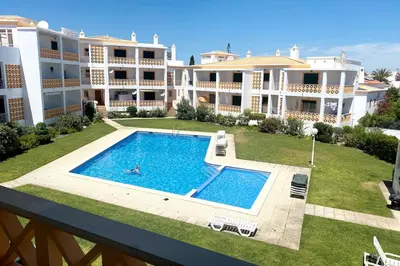 an overhead view of a swimming pool in front of a building at C Dreams - Comfortable and luminous apartment in Albufeira