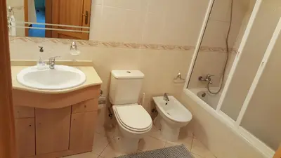 a bathroom with a sink and a toilet and a shower at Albufeira - T2 Old Town Central - 200m Beach in Albufeira