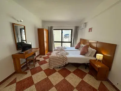 a dining room with a table and a refrigerator at Cerro Atlantico by Umbral in Albufeira
