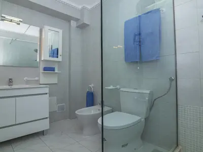 a bathroom with a toilet and a glass shower at Villa Galé 600m from the beach by Interhome in Patroves