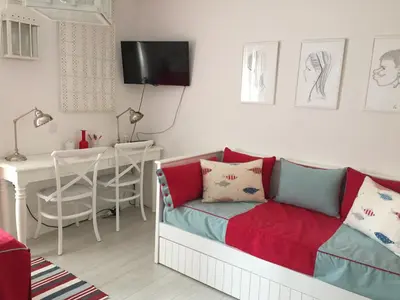 a living room with a couch and a table at Vilamoura Villa Alegria in Vilamoura