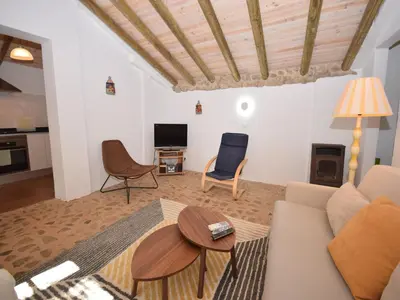 a bedroom with a bed and a hallway at Algarve Casa with Pool in Loulé