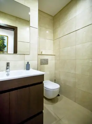 a bathroom with a sink and a toilet at Villa Rafaella II Palace by Atlantic Places in Albufeira