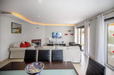 a living room with a couch and a table at Villa Rafaella II Palace by Atlantic Places in Albufeira