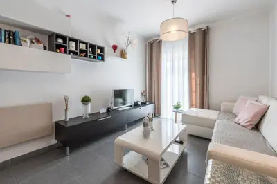 a living room with a couch and a table at Albufeira Oldtown 330ft Beach Parking AC Wifi in Albufeira