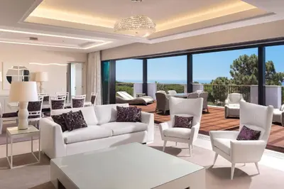 a bathroom with two sinks and a shower at Pine Cliffs Ocean Suites, a Luxury Collection Resort & Spa, Algarve in Albufeira