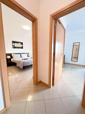 a room with a bed and a door leading to a bedroom at Luxury Apartment Ocean View by Be Cherish in Páteo