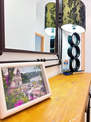 a painting on a table with a lamp and a picture at Luxury Apartment Ocean View by Be Cherish in Páteo