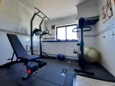 a gym with two exercise bikes in a room at Villa Quinta do Algarve in Albufeira