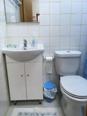 a bathroom with a sink and a toilet at Casa Portuguesa in Albufeira