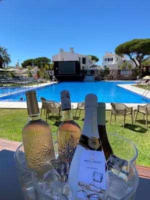 a group of people holding glasses of champagne at Apartamentos Honorio - Pool and Garden in Vilamoura
