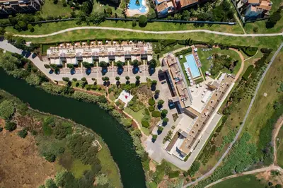 an aerial view of a resort complex next to a river at Laguna - Vilamoura in Vilamoura