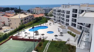 an aerial view of a tennis court in a city at Vista das Ondas Apartamento 205 B2 - Olhos de Agua in Albufeira