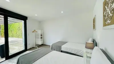 a white room with two beds and a window at Strip by Check-in Portugal in Albufeira