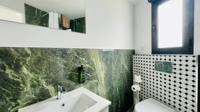 a bathroom with a sink and a mirror at Strip by Check-in Portugal in Albufeira