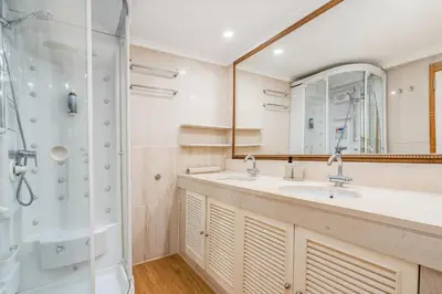 a bathroom with a sink and a shower at Marina Vilamoura Triplex in Vilamoura