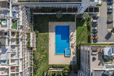 an overhead view of an apartment complex with a swimming pool at Marina Vilamoura Triplex in Vilamoura