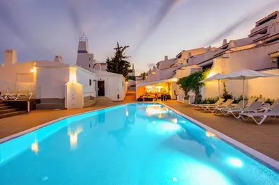 a swimming pool in front of a building at 3HB Golden Beach in Albufeira