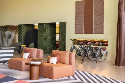 a restaurant with tables and chairs and a bar at Kimpton Atlantico Algarve by IHG in Albufeira