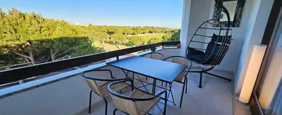 a table and chairs on a balcony with a view at Golf & Mar - T2 Apartment in Vilamoura