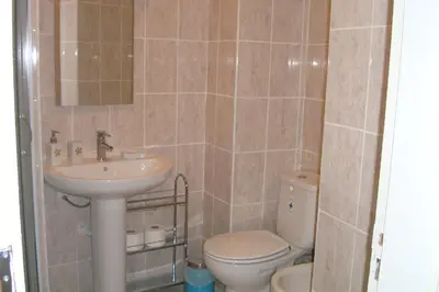 a bathroom with a toilet and a sink at Studio near the beach in Albufeira
