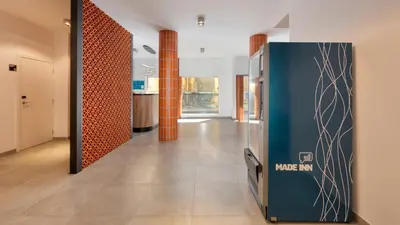 a hallway with a door in a building at Hotel Made inn Faro in Faro