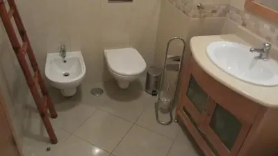 a bathroom with a toilet and a sink at Encosta Da Orada by Garvetur in Albufeira