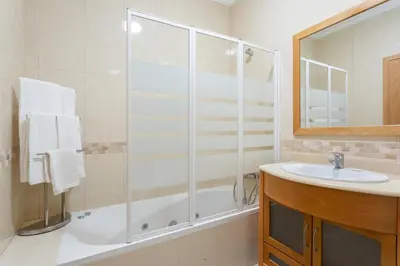 a bathroom with a shower and a sink at Encosta Da Orada by Garvetur in Albufeira