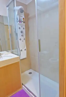a bathroom with a shower and a sink at Apartamento Olhos D'Água in Albufeira