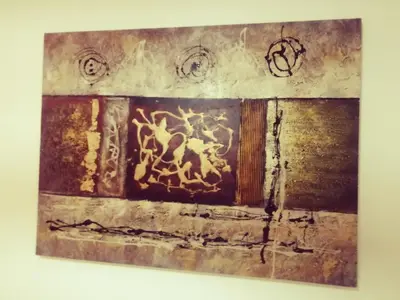 a painting hanging on a wall in a room at Apartamento S. Luis in Faro