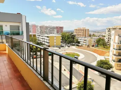 a balcony with a view of a city at Apartamento Penha in Faro