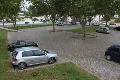 a group of cars parked in a parking lot at 5 Minutes Walk from the Beach in Albufeira