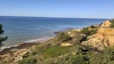 a view of the ocean from a cliff at Olhos de Água Apartment Albufeira in Albufeira
