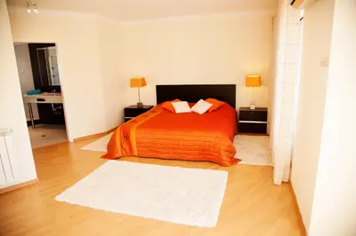 a living room with a table and chairs at Villa Clara Premium by Sunny Deluxe in Albufeira